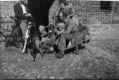 Resting in the Farmyard: Frederik & Grete in the Wheelbarrow, with Rolf the Dog