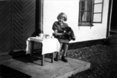 Grete Having Tea with Figger on the Front Step